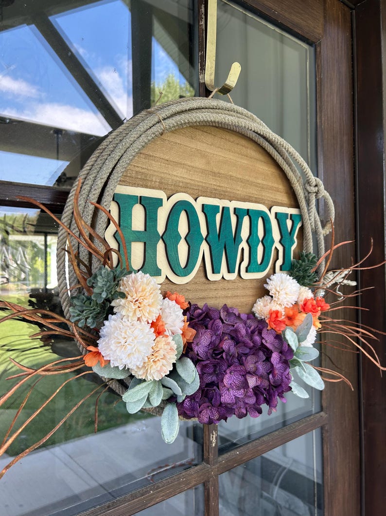 Howdy western door hanger with rope border and flowers